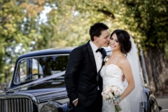 Melissa & Adrian with wedding bouquet